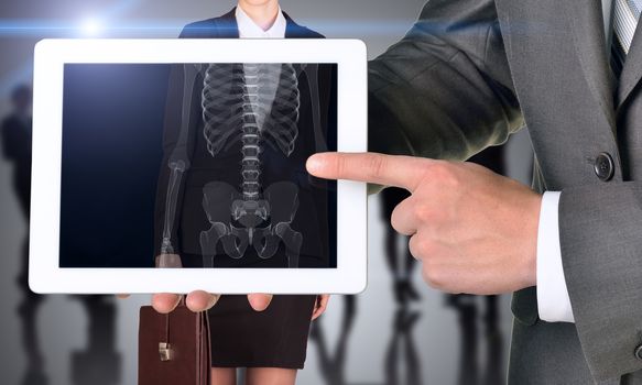 Businessman with tablet and xray human body