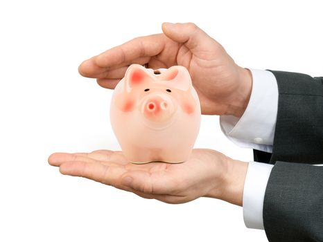 Male hands holding piggy bank on isolated white background