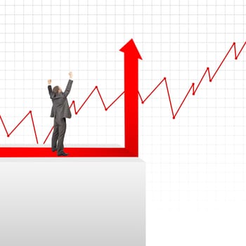 Happy businessman standing on edge of chart on grey background