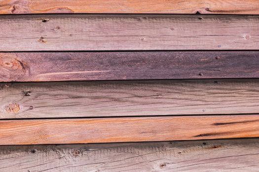 Rustic weathered barn wood background with knots and nail holes