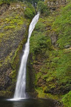 The Columbia River Gorge is a canyon of the Columbia River in the Pacific Northwest of the United States. Up to 4,000 feet (1,200 m) deep, the canyon stretches for over 80 miles (130 km) as the river winds westward through the Cascade Range forming the boundary between the State of Washington to the north and Oregon to the south. The area is famous for its many waterfalls.