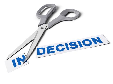 Scissors cut the word indecision in two parts, the first one with the suffix in and the second one with the word decision, conceptual image for deciding.
