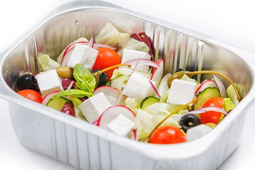 Portion of food in the container isolated on white