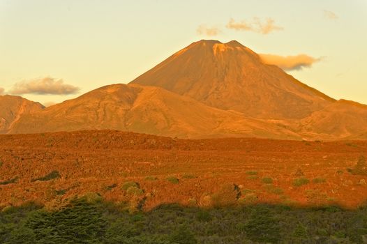 Mt Ngauruhoe in unusual red sunset glow, Tongariro National Park, New Zealand