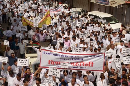 INDIA, Ajmer: Indian jewellers hold banners against the government during a protest against excise duties on gold in Ajmer on March 15, 2016.Jewellers across India are on an indefinite strike in a bid to force the government to shelve plans for a controversial excise tax announced in the annual budget 