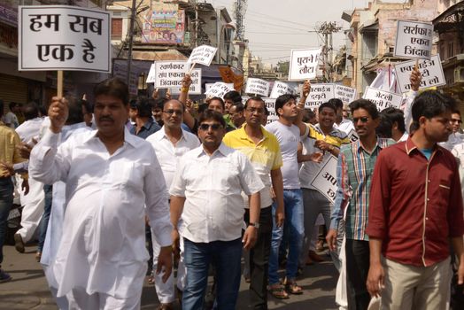 INDIA, Ajmer: Indian jewellers hold banners against the government during a protest against excise duties on gold in Ajmer on March 15, 2016.Jewellers across India are on an indefinite strike in a bid to force the government to shelve plans for a controversial excise tax announced in the annual budget 