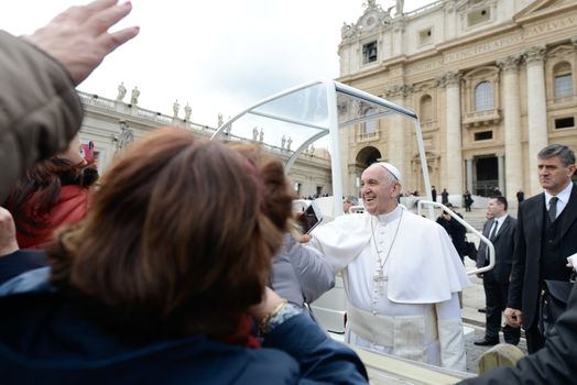 VATICAN: Pope Francis waves to the crowd as he arrives for his weekly general audience at St Peter's square on March 16, 2016 in Vatican. 