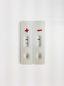 Positive and negative test cassette strips for analysis of HCG hormone in the urine