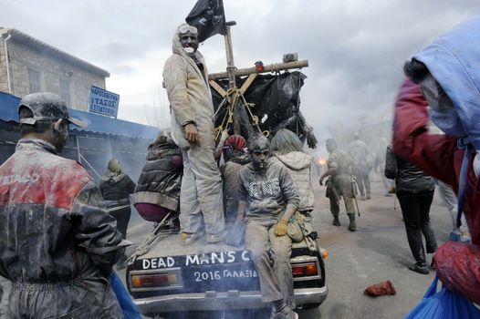 GREECE, Galaxidi: People ride on the back of a car to the annual flour battle on March 14, 2016. The battle takes place every year on 'Clean Monday', which marks the beginning of the Christian lent festival.The coastal town has observed this festive event which dates back to the mid 19th century. 