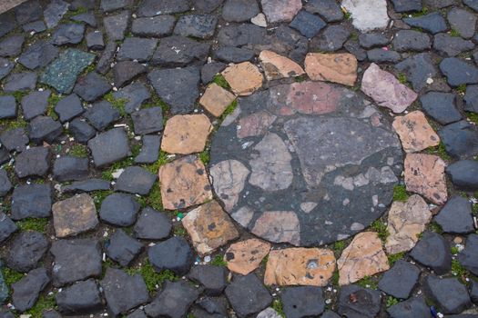 Dark color of the stones with a circular detail in different colors.