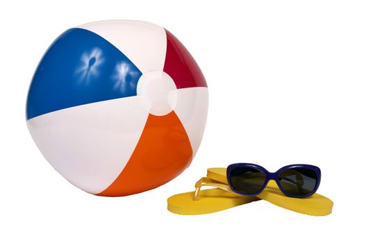 Horizontal of beach accessories, beach ball, yellow flip flops and sunglasses.  Isolated on white background.