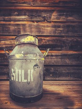 A Traditional Milk Urn On The Porch Of A Farmhouse Or Homestead