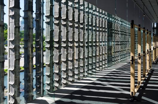 Vertical extruded brick wall with light and shadow, effect of light with architecture