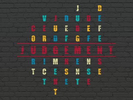 Law concept: Painted red word Judgement in solving Crossword Puzzle
