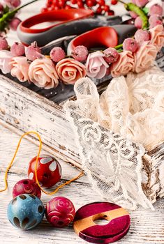 Sewing kit made of lace,buttons,beads and thread with needle
