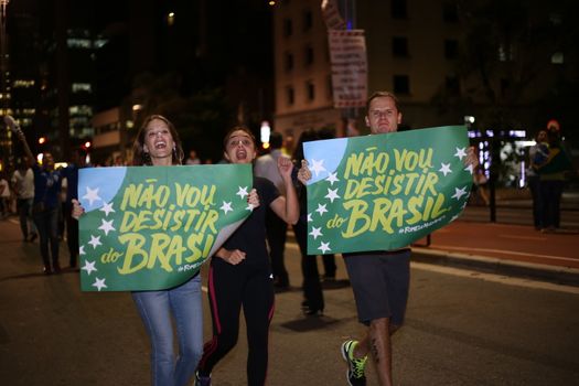 BRAZIL, Sao Paulo: Protesters hold placards which read I will not give up Brazil, as thousands gather on the Paulista Avenue, in Sao Paulo, during a pro-impeachment rally, on March 16, 2016. Outraged Brazilians protested in Brasilia and Sao Paulo following the release of a taped phone call between President Dilma Rousseff and her predecessor Luiz Inacio Lula da Silva. On Sunday, an estimated three million Brazilians flooded the streets in nationwide protests calling for Rousseff's departure.