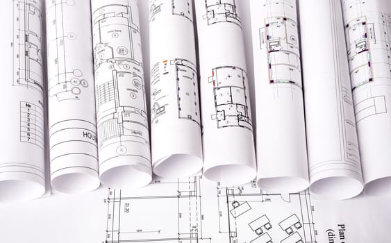 Architecture plan and rolls of blueprints, top view. Building concept