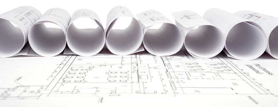 Architecture plan and rolls of blueprints, front view. Building concept