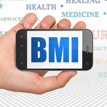Medicine concept: Hand Holding Smartphone with  blue text BMI on display,  Tag Cloud background