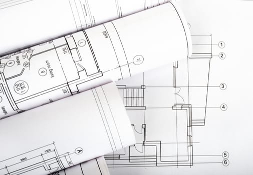 Architecture plan and rolls of blueprints closeup. Building concept