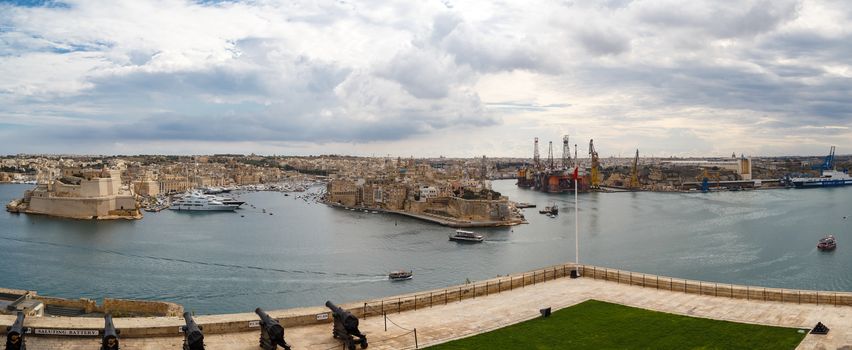VALLETTA, MALTA - OCTOBER 30, 2015 : Panoramic view of the gardens of Lascaris War Rooms in Valletta, Malta, with seascape on cloudy blue sky background.