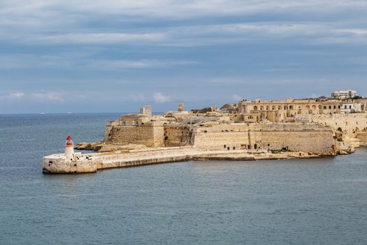 General view of Valletta, Malta island with seascape, port and historical limestone buildings from medieval times.