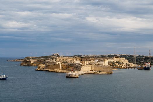 VALLETTA, MALTA - OCTOBER 30, 2015 : General view of Valletta, Malta island with seascape, port and historical limestone buildings from medieval times.