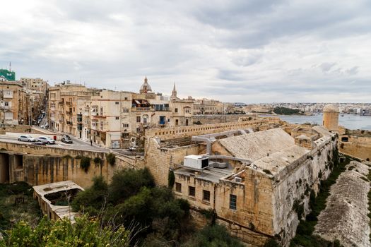 VALLETTA, MALTA - OCTOBER 30, 2015 : General view of Valletta cityscape at Malta island with historical limestone buildings from medieval times.