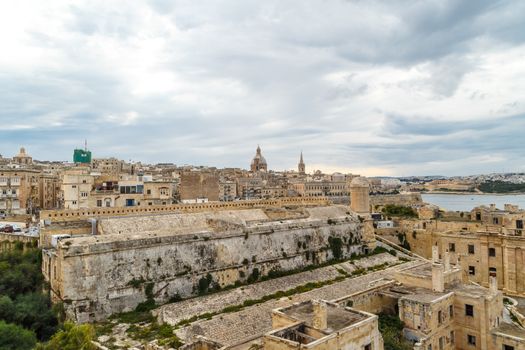 General view of Valletta cityscape at Malta island with historical limestone buildings from medieval times.