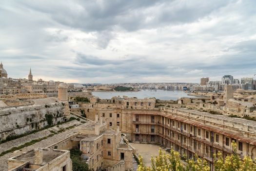 General view of Valletta cityscape at Malta island with historical limestone buildings from medieval times.