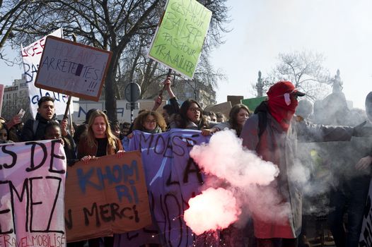 FRANCE, Paris: A protester holds a smoke-bomb during a student demonstration against French government Labour Law reform in Paris on March 17, 2016.