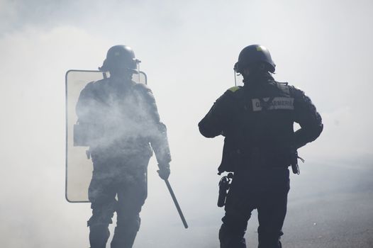 FRANCE, Paris: Riot police officers face demonstrators during a student demonstration against French government Labour Law reform in Paris on March 17, 2016.