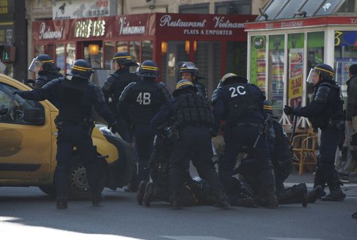 FRANCE, Paris: A protester is arrested by riot police during a student demonstration against French government Labour Law reform in Paris on March 17, 2016.