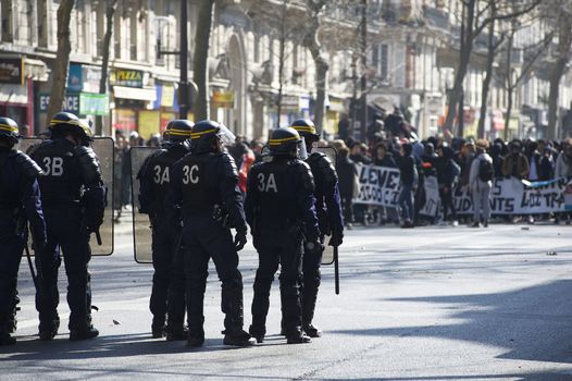FRANCE, Paris: Riot police officers face demonstrators during a student demonstration against French government Labour Law reform in Paris on March 17, 2016.