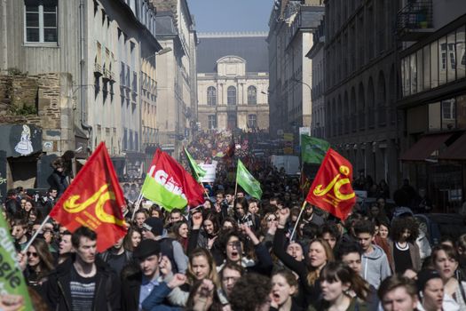 FRANCE, Paris: High school students and youths demonstrate in front of Rennes' town hall, western France,  during a protest march opposing the government's labour reforms on March 17, 2016. The contested reform is designed to inject more flexibility into the labour market by dropping key measures that would have benefited smaller companies. In a significant change from the original text, French Prime minister said on Monday that small and medium-sized companies would not be able to unilaterally introduce flexible work practices into their working week.
