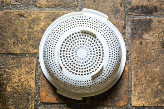 aerial view of a white plastic colander