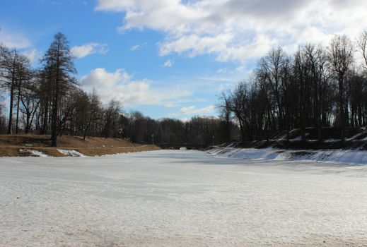 Karpin pond, covered with melting ice in spring Gatchina Park, 2016.