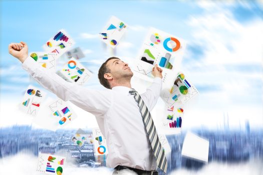 Businessman with paper looking up and graphs, freedom concept