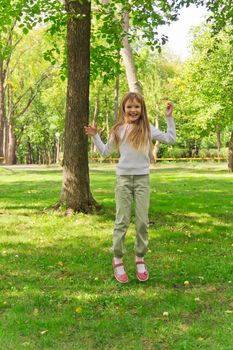 Photo of cute jumping girl in summer