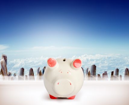 Piggy bank on cityscape background, money concept