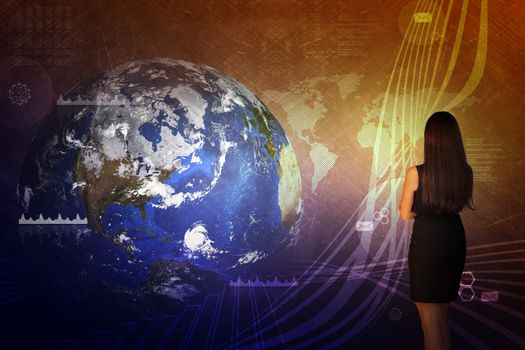 Businesswoman in front of world map with graphical charts, business concept