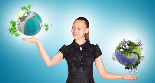 Businesswoman holding two earth globes, saving planet concept