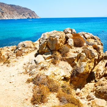 in greece the mykonos island rock sea and beach    sky