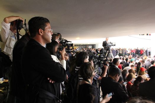BRAZIL, Brasilia: Members of the media pack the room during a ceremony to appoint former President Luiz Inácio Lula da Silva to the cabinet on March 17, 2016 in Brasilia.The decision resulted in protests throughout the country, with some thinking that the appointment of the former president was an attempt to save him from charges in a corruption scandal.