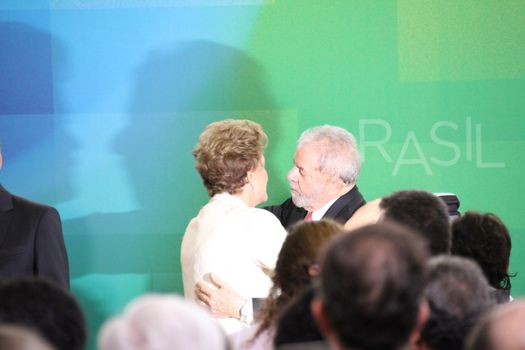 BRAZIL, Brasilia: President Dilma Rousseff embraces former President Luiz Inácio Lula da Silva on March 17, 2016 in Brasilia.The decision resulted in protests throughout the country, with some thinking that the appointment of the former president was an attempt to save him from charges in a corruption scandal.