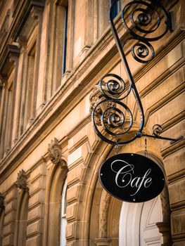 Ornate Sign For An Exclusive Cafe In A European City
