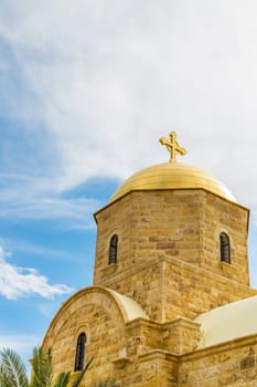 Modern Orthodox church at the Jordan River near Bethany Beyond the Jordan. Photographed close-up on a bright sunny day.