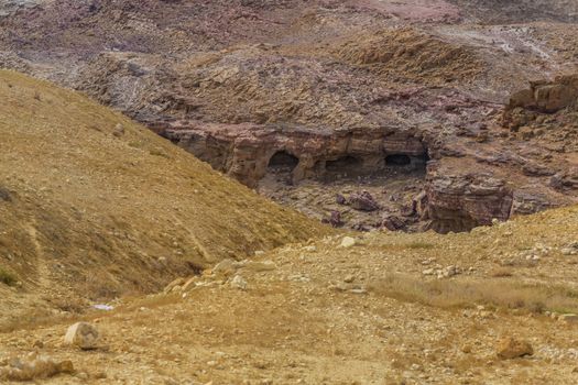 Ancient cave settlement Bedouins. Desert mountain landscape, Jordan. Sand and gravel hills and ravines in the mountain areas of Jordan. Desert mountain landscape