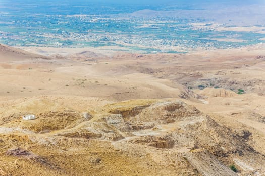 Sand and gravel hills and ravines in the mountain areas of Jordan. Desert mountain landscape