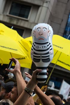 Sao Paulo Brazil March 13, 2016: One unidentified group of people in the biggest protest against federal government corruption in Sao Paulo with an inflated doll called pixuleco.